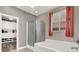 Bathroom featuring a glass shower, a soaking tub, and neutral-toned walls for a clean, modern look at 920 Claystone Ridge Ave, North Las Vegas, NV 89084