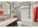 Bathroom with a tub-shower combo, complete with a shower curtain and a vanity with a sink at 920 Claystone Ridge Ave, North Las Vegas, NV 89084