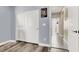 Bedroom with a closet having sliding doors and laminate flooring, providing functional storage and style at 920 Claystone Ridge Ave, North Las Vegas, NV 89084