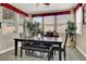 Bright dining area with windows, a ceiling fan, and neutral walls at 920 Claystone Ridge Ave, North Las Vegas, NV 89084