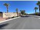 Community entrance featuring the neighborhood sign and neat landscaping showcasing a welcoming atmosphere at 920 Claystone Ridge Ave, North Las Vegas, NV 89084