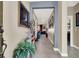 Inviting hallway with elegant decor, neutral paint, and tile flooring, creating a warm welcome at 920 Claystone Ridge Ave, North Las Vegas, NV 89084