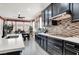 Charming kitchen featuring stainless appliances, white countertops, and a window overlooking the dining area at 920 Claystone Ridge Ave, North Las Vegas, NV 89084