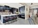 Modern kitchen with dark cabinetry, stainless steel appliances, a center island, and stylish backsplash at 920 Claystone Ridge Ave, North Las Vegas, NV 89084