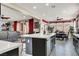 Open-concept kitchen and living area with bar seating, perfect for entertaining and modern living at 920 Claystone Ridge Ave, North Las Vegas, NV 89084