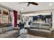 Comfortable living room showcasing a seamless open floor plan connecting to the kitchen area at 920 Claystone Ridge Ave, North Las Vegas, NV 89084