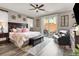 Cozy main bedroom featuring a decorative bed, outdoor access, and stylish decor at 920 Claystone Ridge Ave, North Las Vegas, NV 89084