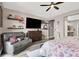 Relaxing main bedroom features a comfortable seating area, decorative shelves, and stylish furniture at 920 Claystone Ridge Ave, North Las Vegas, NV 89084