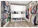 Organized walk-in closet with shelving and hanging space for clothes and accessories at 920 Claystone Ridge Ave, North Las Vegas, NV 89084