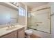 Bathroom with a shower-tub, and light wood cabinets at 9421 Gold Mountain Dr, Las Vegas, NV 89134