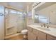 Bathroom showcasing a glass-enclosed shower, marble countertops, and wooden-style floors at 9421 Gold Mountain Dr, Las Vegas, NV 89134