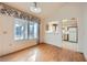 Bright dining area featuring hardwood floors and a large window with a decorative valance at 9421 Gold Mountain Dr, Las Vegas, NV 89134