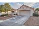 Charming single-story home with stucco exterior, tile roof, and two-car garage at 9421 Gold Mountain Dr, Las Vegas, NV 89134