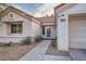 Charming single-story home with stucco exterior, and walkway to entry at 9421 Gold Mountain Dr, Las Vegas, NV 89134