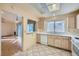 Kitchen area with white appliances and tile flooring that is open to living room at 9421 Gold Mountain Dr, Las Vegas, NV 89134