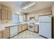 Clean kitchen featuring white appliances, countertops, and tile floors at 9421 Gold Mountain Dr, Las Vegas, NV 89134