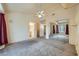 Large main bedroom boasting mirrored closet doors, a ceiling fan, and ensuite bathroom at 9421 Gold Mountain Dr, Las Vegas, NV 89134