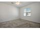 Bright bedroom featuring neutral carpet, ceiling fan, and a window with blinds at 965 Nevada State Dr # 39201, Henderson, NV 89002