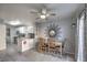 Cozy dining area with a modern ceiling fan, stylish decor, and direct access to the kitchen at 9655 Idle Spurs Dr, Las Vegas, NV 89123