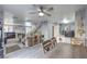 A view of the wide open floor plan with the dining area, staircase, and living room all connected at 9655 Idle Spurs Dr, Las Vegas, NV 89123