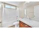 Bathroom with a tub-shower combo, a single sink vanity and a large mirror at 1016 Douglas Flat Pl, Las Vegas, NV 89138