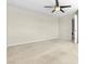 Spacious bedroom includes ceiling fan, neutral walls and carpet, and an ensuite laundry room at 1016 Douglas Flat Pl, Las Vegas, NV 89138