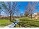 Beautifully maintained community green space featuring a walking path between residential buildings on a sunny day at 1016 Douglas Flat Pl, Las Vegas, NV 89138