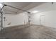 Spacious two car garage with white walls and ceiling and concrete floors at 1016 Douglas Flat Pl, Las Vegas, NV 89138