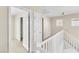 Upstairs hallway with white trim, leading to bedrooms and closet space at 1016 Douglas Flat Pl, Las Vegas, NV 89138