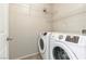 Laundry room featuring a side-by-side washer and dryer and wire shelving at 1016 Douglas Flat Pl, Las Vegas, NV 89138