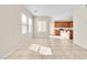 Bright living space featuring tile flooring, an open layout, and views of the adjacent kitchen at 1016 Douglas Flat Pl, Las Vegas, NV 89138