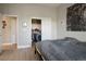 Bedroom featuring an open closet with custom shelving for optimized storage solutions at 10320 Bent Brook Pl, Las Vegas, NV 89134