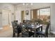 Dining room boasting lots of space with contemporary table, chairs, and natural light at 10320 Bent Brook Pl, Las Vegas, NV 89134