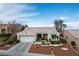 Beautiful single-story home with a two-car garage, desert landscaping, and a welcoming front entrance at 10320 Bent Brook Pl, Las Vegas, NV 89134