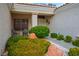 Inviting front porch with mature landscaping and seating area at 10320 Bent Brook Pl, Las Vegas, NV 89134