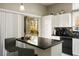 Open concept kitchen island featuring great natural lighting and modern appliances at 10320 Bent Brook Pl, Las Vegas, NV 89134