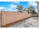 Fenced backyard with rock landscaping and concrete patio space for outdoor enjoyment at 104 Hutton Ln, Las Vegas, NV 89145