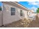 Exterior view of home backyard showing rock landscaping and concrete patio area at 104 Hutton Ln, Las Vegas, NV 89145