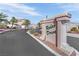 Elegant stone sign marking the entrance to the Rodeo Drive community with lush landscaping at 104 Hutton Ln, Las Vegas, NV 89145