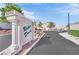 Community entrance sign for Rodeo Drive with well-maintained landscaping and a gated entry at 104 Hutton Ln, Las Vegas, NV 89145