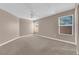 Spacious main bedroom featuring neutral carpet, and a ceiling fan at 104 Hutton Ln, Las Vegas, NV 89145