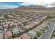 Stunning aerial perspective of a sprawling residential community with a mountain backdrop at 10564 Tranquil Glade Ln, Las Vegas, NV 89135