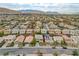 Wide aerial shot of a suburban neighborhood showcasing well-manicured lawns and rooftops at 10564 Tranquil Glade Ln, Las Vegas, NV 89135