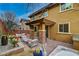 Charming back patio with a hot tub, lounge area, and lush landscaping for outdoor living at 10564 Tranquil Glade Ln, Las Vegas, NV 89135