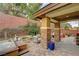 Relaxing back patio with a hot tub and outdoor seating area, perfect for entertaining at 10564 Tranquil Glade Ln, Las Vegas, NV 89135