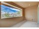 Balcony with stucco walls and framed view of nearby homes and trees at 10564 Tranquil Glade Ln, Las Vegas, NV 89135