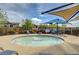 Community wading pool with shaded umbrellas and lounge chairs for relaxing poolside at 10564 Tranquil Glade Ln, Las Vegas, NV 89135