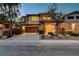 Charming two-story home featuring a 2-car garage, with stone accents and tasteful landscaping at 10564 Tranquil Glade Ln, Las Vegas, NV 89135