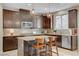 Well-equipped kitchen featuring granite countertops, modern appliances, and ample cabinet space at 10564 Tranquil Glade Ln, Las Vegas, NV 89135