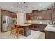 Modern kitchen featuring stainless steel appliances, granite countertops, and custom cabinets at 10564 Tranquil Glade Ln, Las Vegas, NV 89135